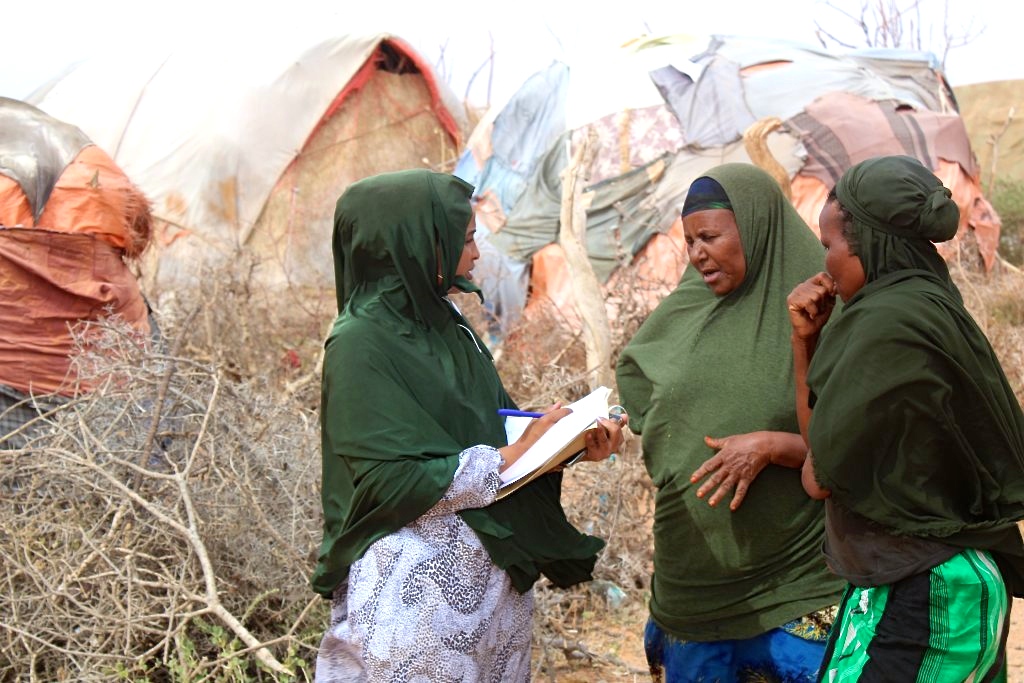 Hamda Mohamed is registering which vulnerable people are eligible to receive a hygiene kit in the village of Habariheshay in the Sool region – A.jpg