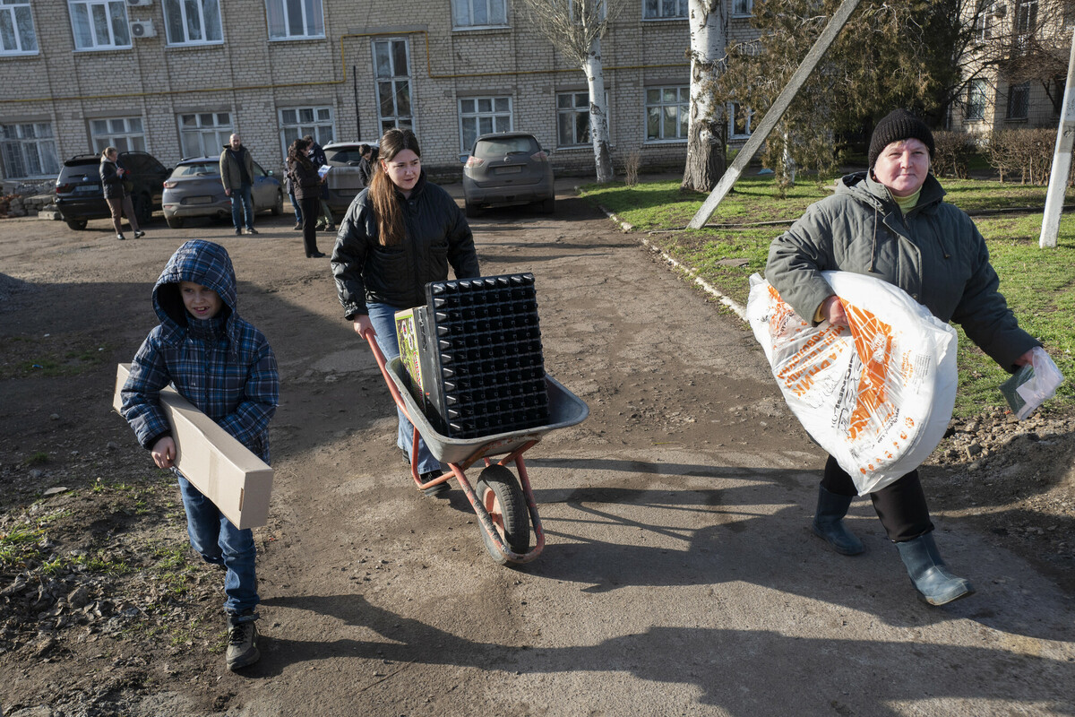 Family receives farming items from RWBN distribution_scr.jpg